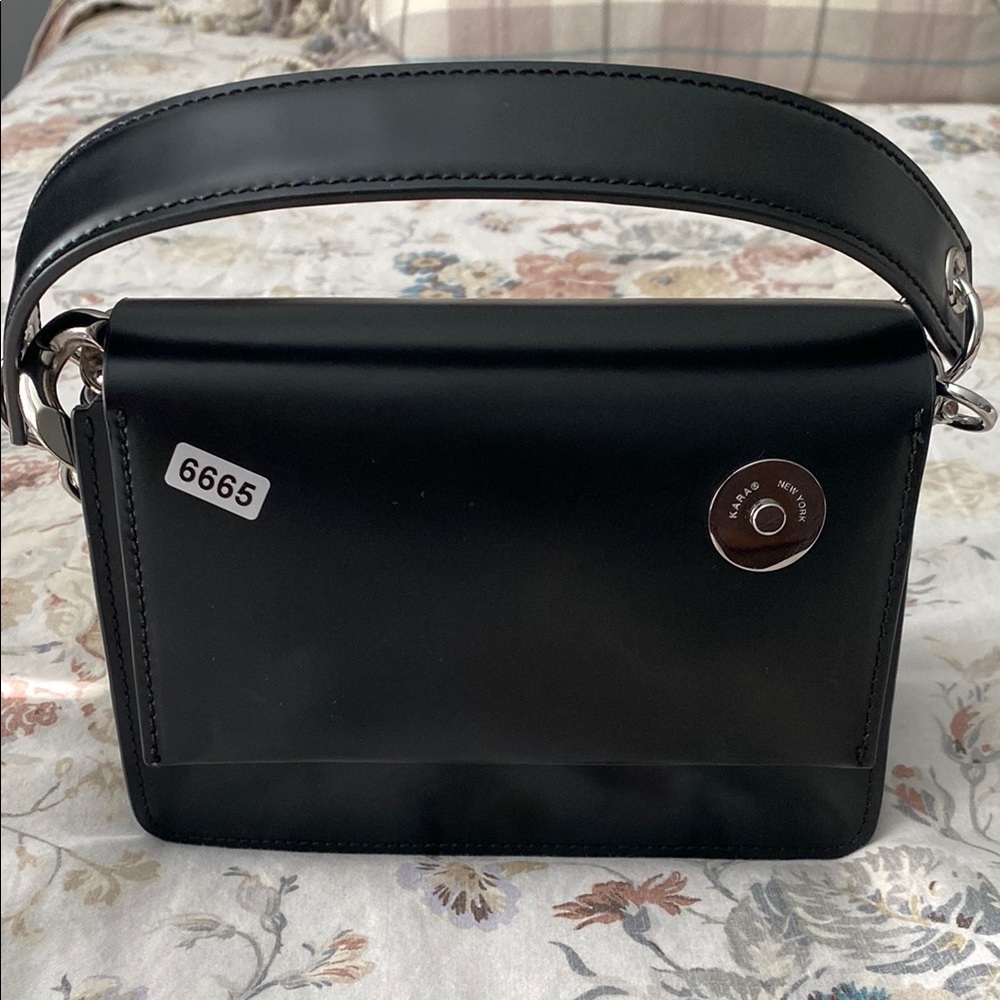 Black Shoulder Bag with Sleek Design and Silver Accents